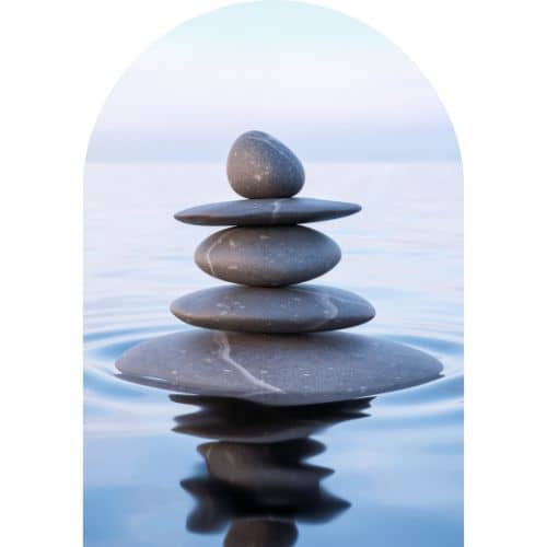 5 rocks balancing stacked one on the other in water.